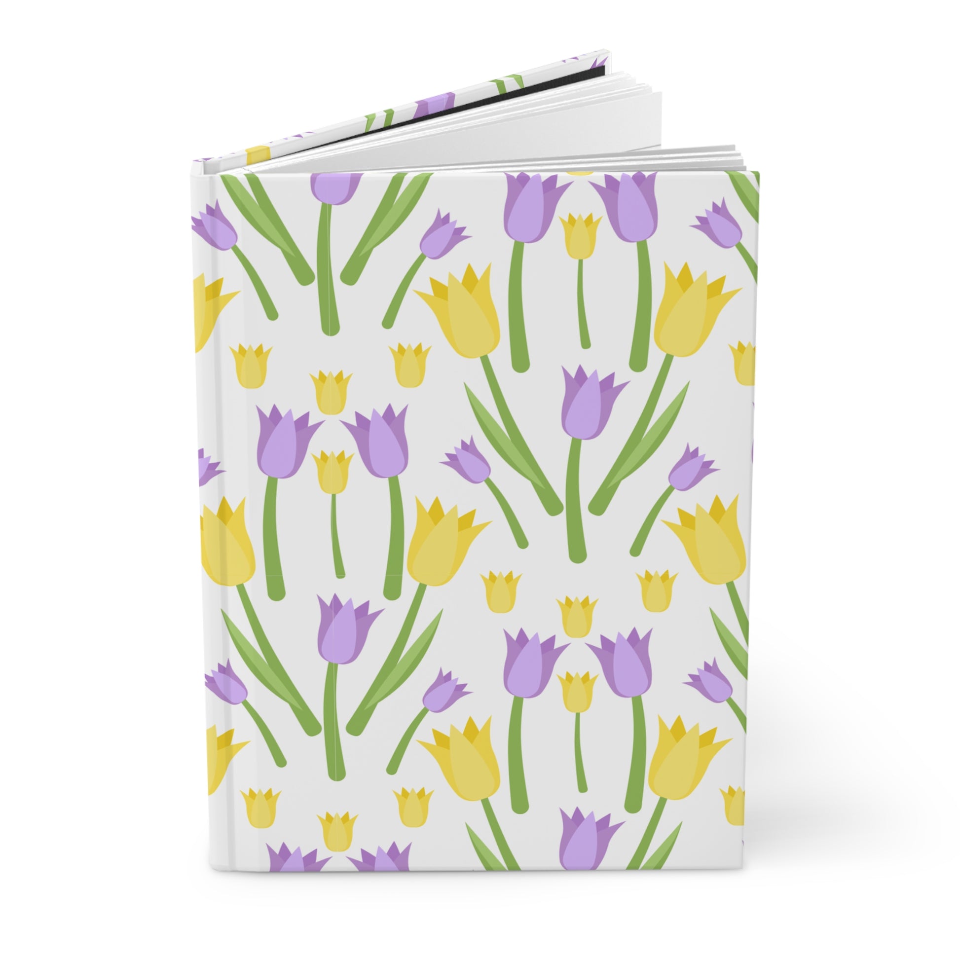 Hardcover journal with a yellow and lavender tulip pattern, shown partially open to display the pages inside.
