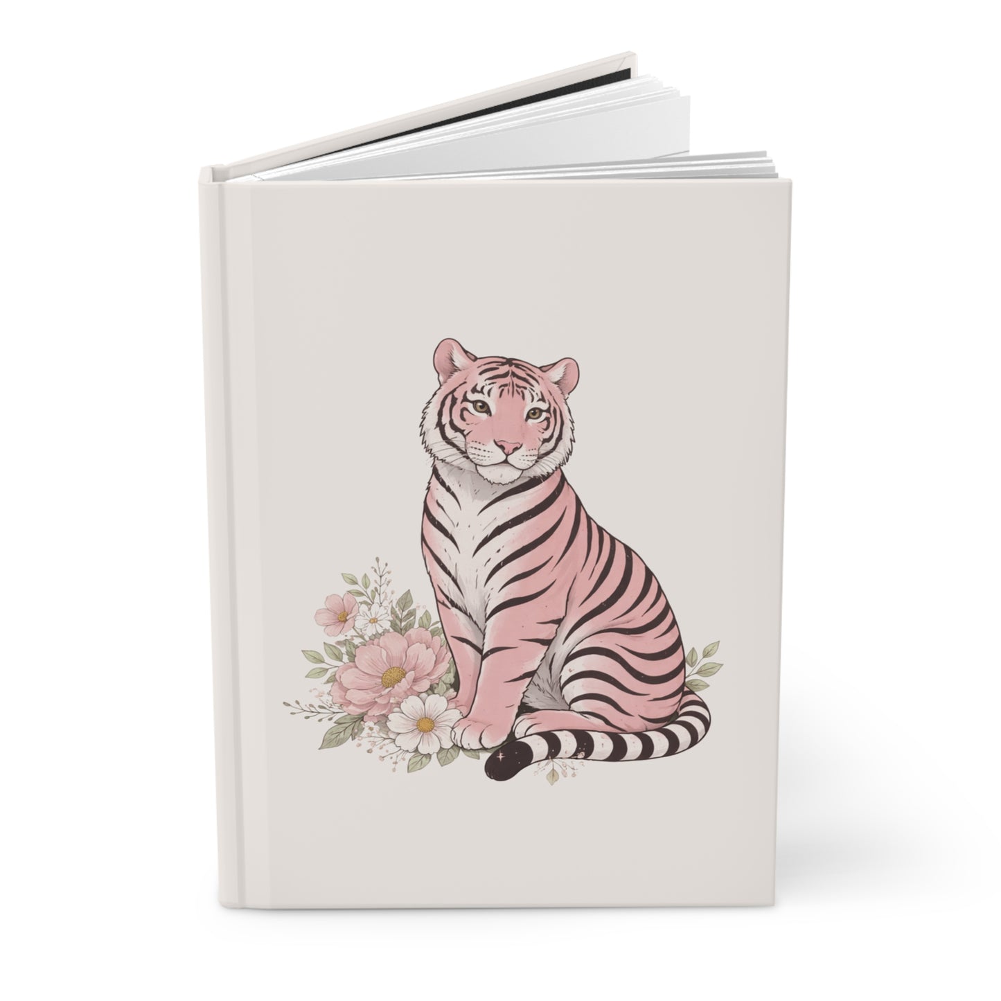 A soft, feminine hardcover journal featuring a pink tiger sitting among pastel flowers on a clean cream background