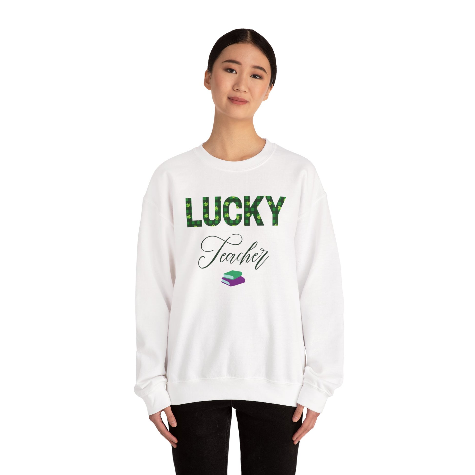 Model wearing a white Lucky Teacher sweatshirt with green clover lettering and book icon.