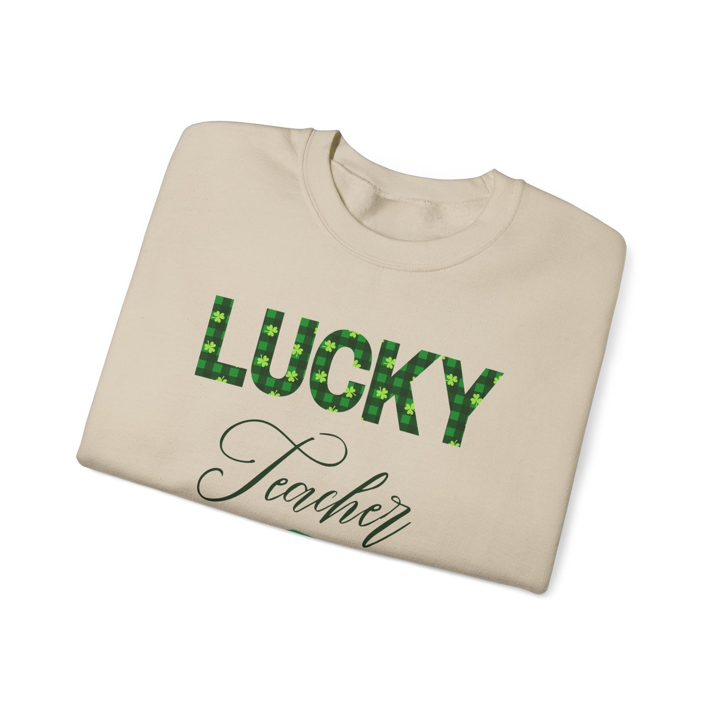 Folded Lucky Teacher sweatshirt with green clover lettering and book icon.