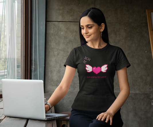 Cute retro pixel heart “Leveling Up Love” tee for gamer girls. Soft women’s fit, vibrant print, perfect Valentine’s gift or everyday gaming style.